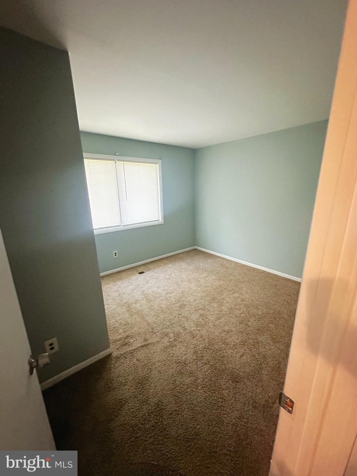 807 C Windstream Way, Unit 807C Edgewood, MD 21040 - Photo 9 of 11 an empty room with a empty space and windows