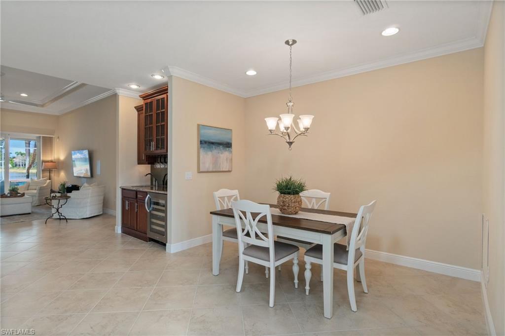 19753 Tesoro Way Estero, FL 33967 - Photo 11 of 47 a view of a dining room with furniture