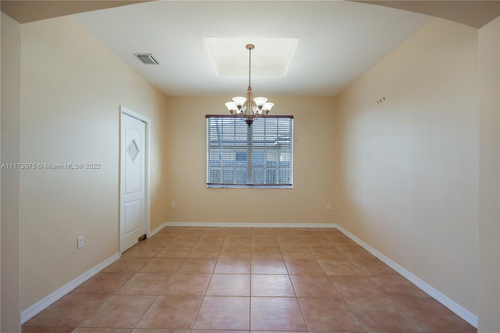 16234 Southwest 48th Terrace Miami, FL 33185 - Photo 11 of 45 an empty room with windows