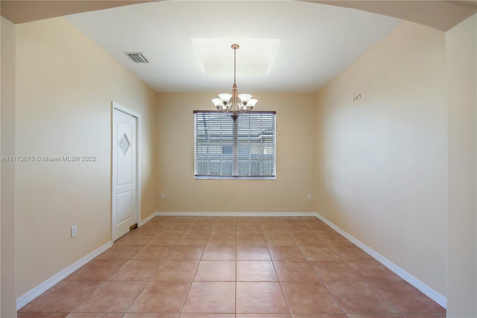 16234 Southwest 48th Terrace Miami, FL 33185 - Photo 12 of 45 an empty room with windows