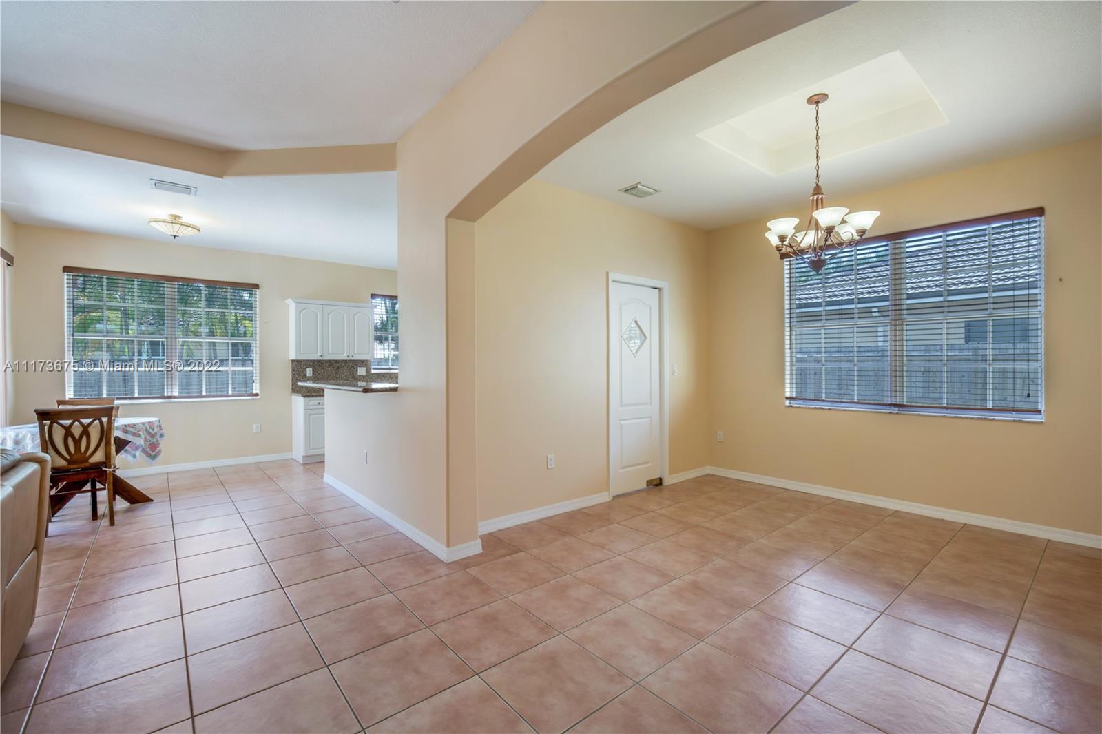 16234 Southwest 48th Terrace Miami, FL 33185 - Photo 13 of 45 a view of livingroom with window and outdoor view