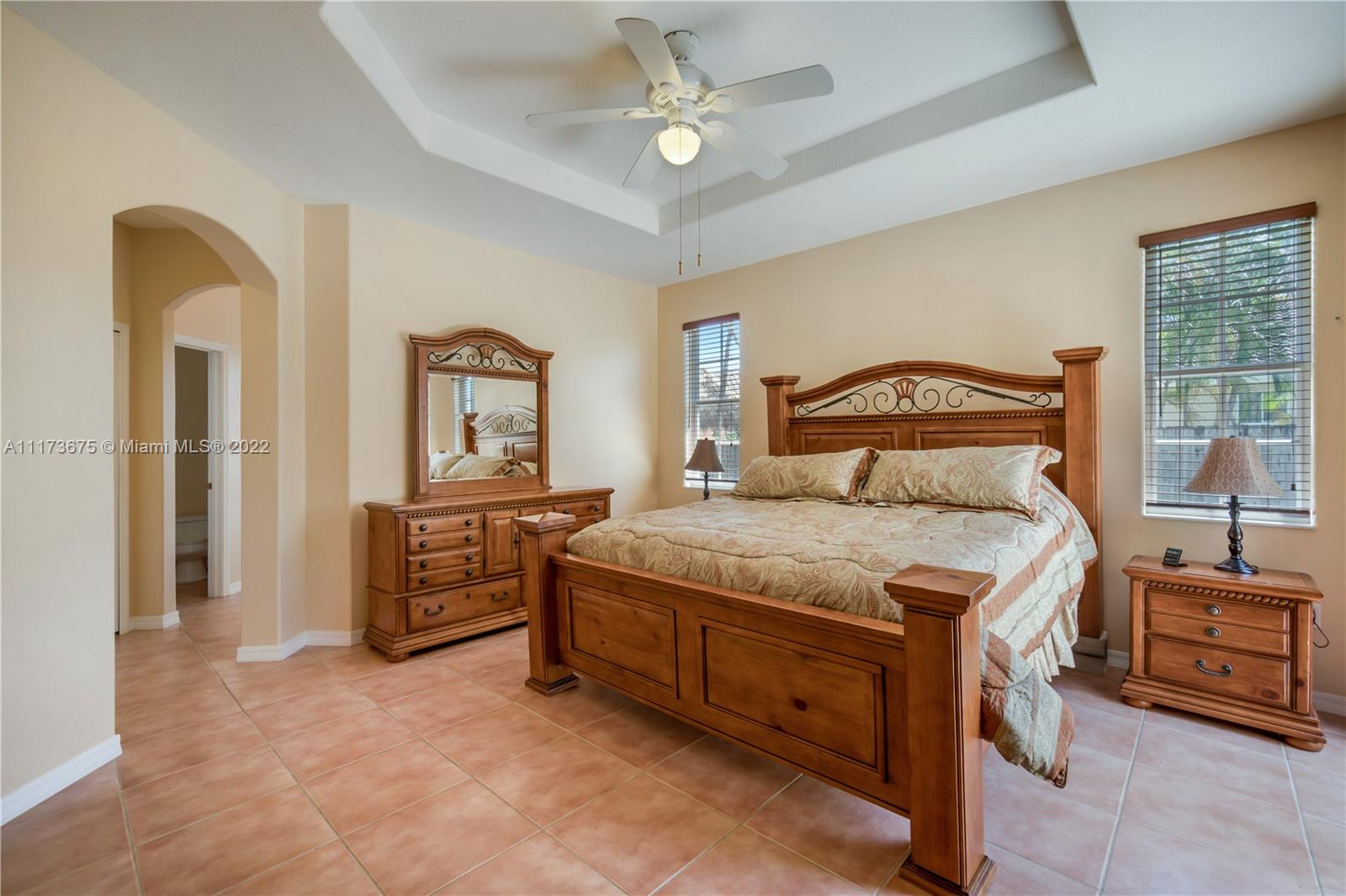 16234 Southwest 48th Terrace Miami, FL 33185 - Photo 30 of 45 a bedroom with a bed and a dresser