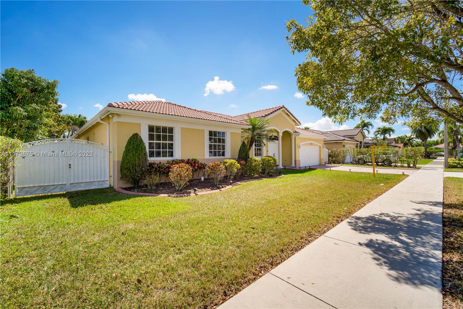 16234 Southwest 48th Terrace Miami, FL 33185 - Photo 3 of 45 a front view of house with yard and green space