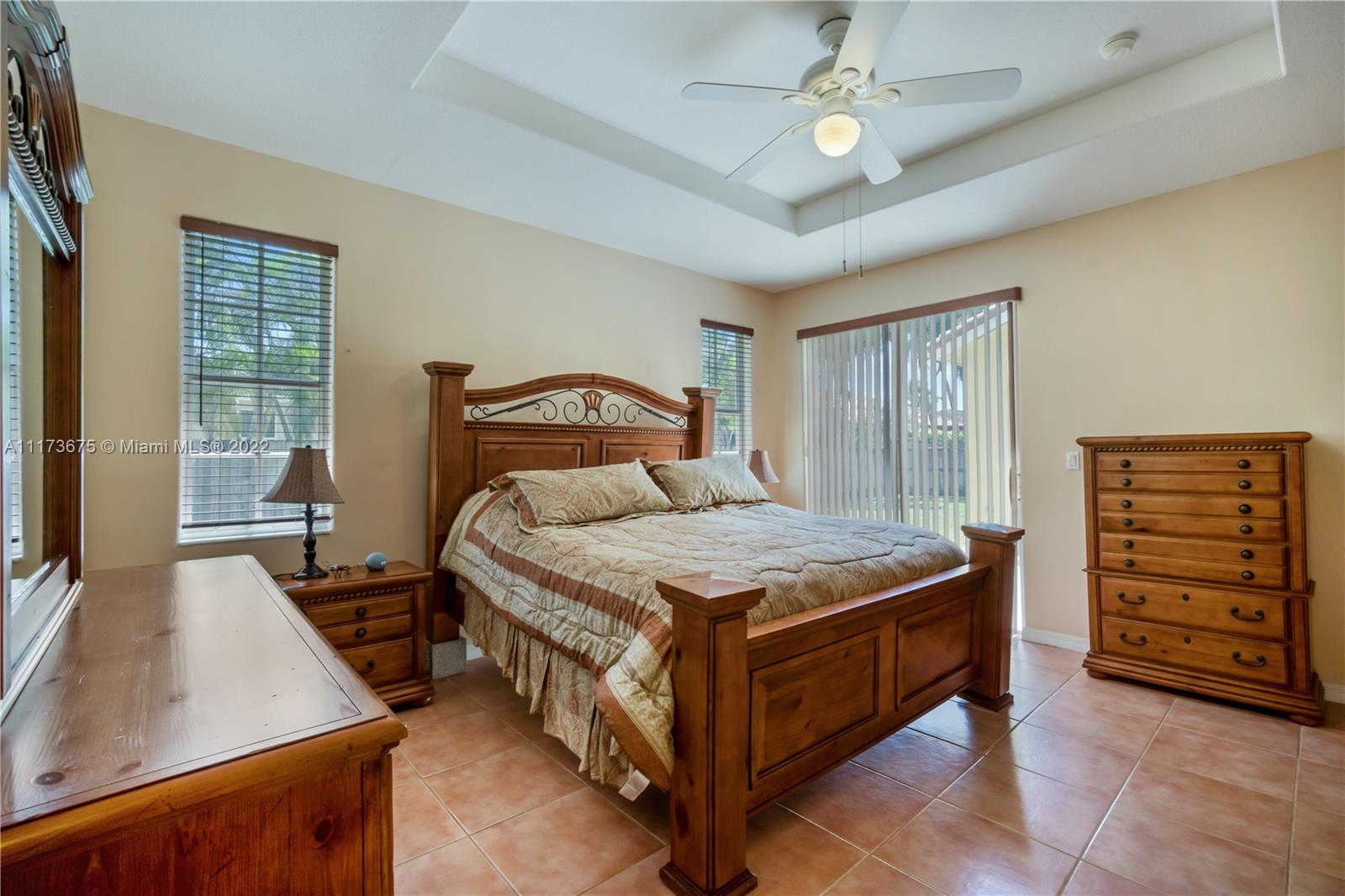 16234 Southwest 48th Terrace Miami, FL 33185 - Photo 31 of 45 a bedroom with a bed and a dresser