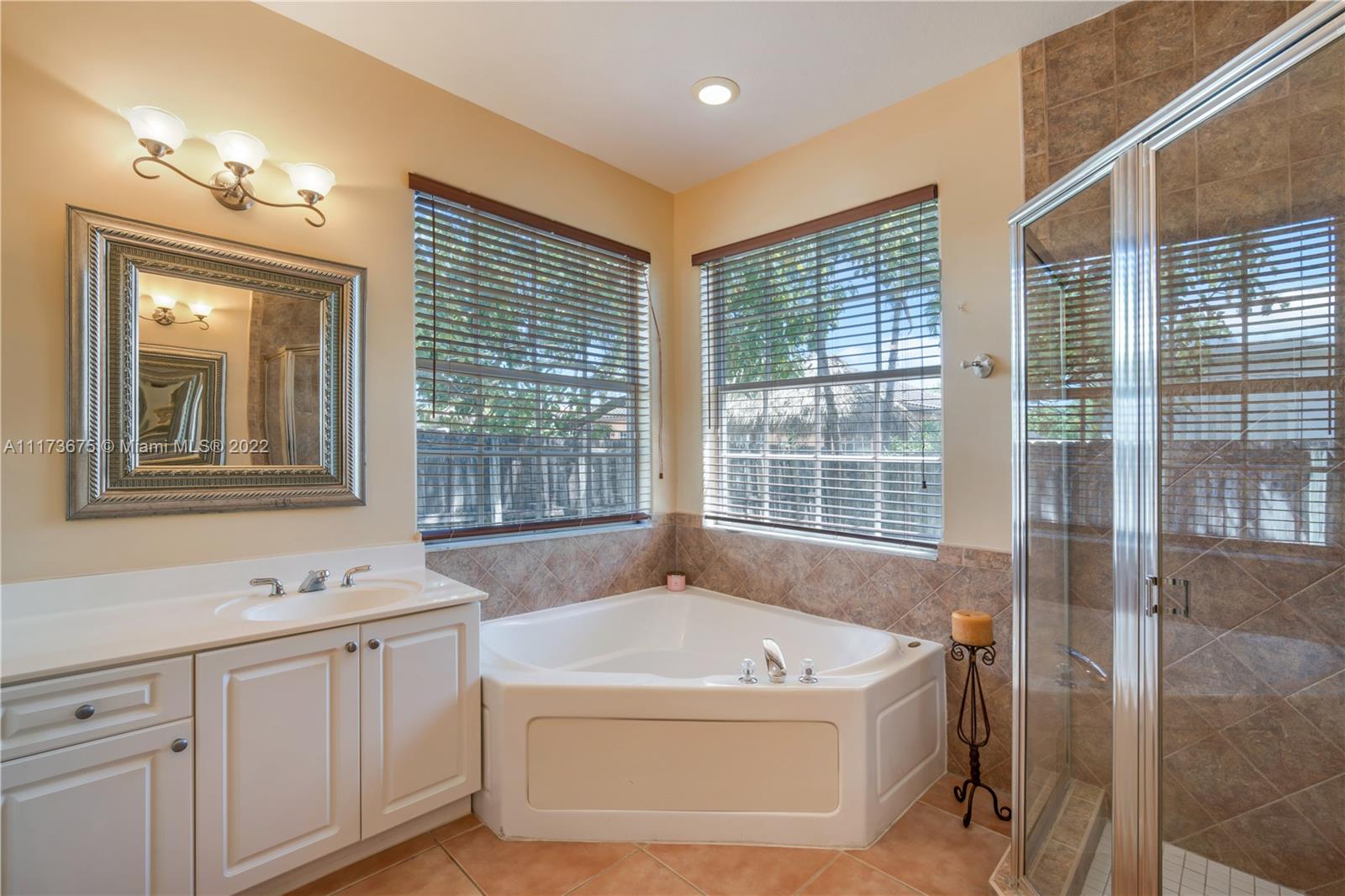 16234 Southwest 48th Terrace Miami, FL 33185 - Photo 35 of 45 a spacious bathroom with sink shower and bathtub