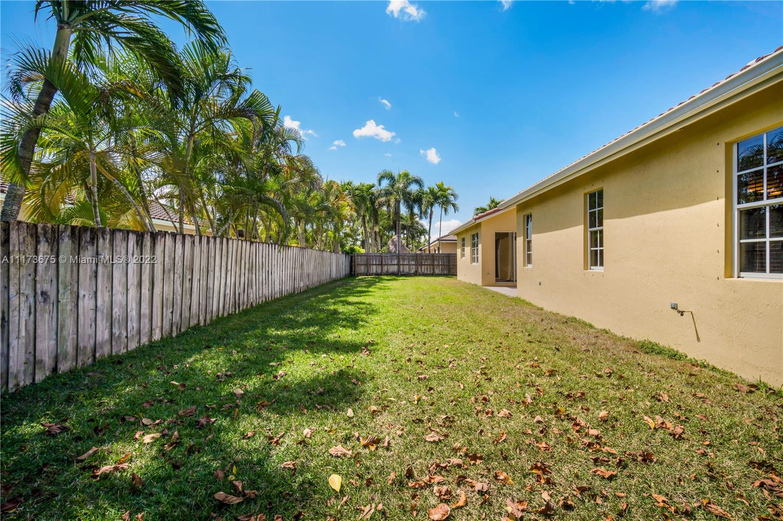 16234 Southwest 48th Terrace Miami, FL 33185 - Photo 39 of 45 a view of a backyard with plants and large trees