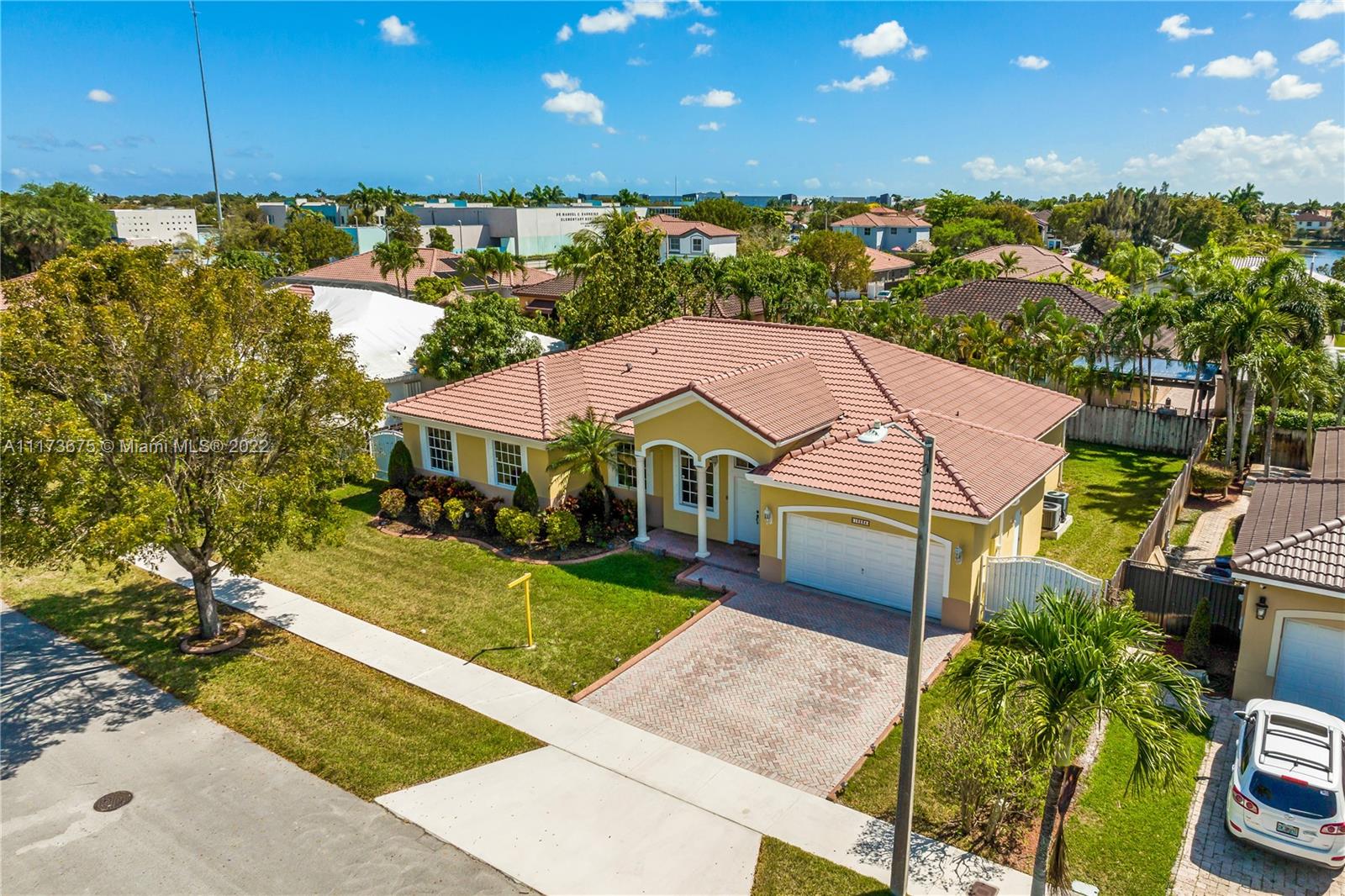 16234 Southwest 48th Terrace Miami, FL 33185 - Photo 42 of 45 a aerial view of a house next to a yard