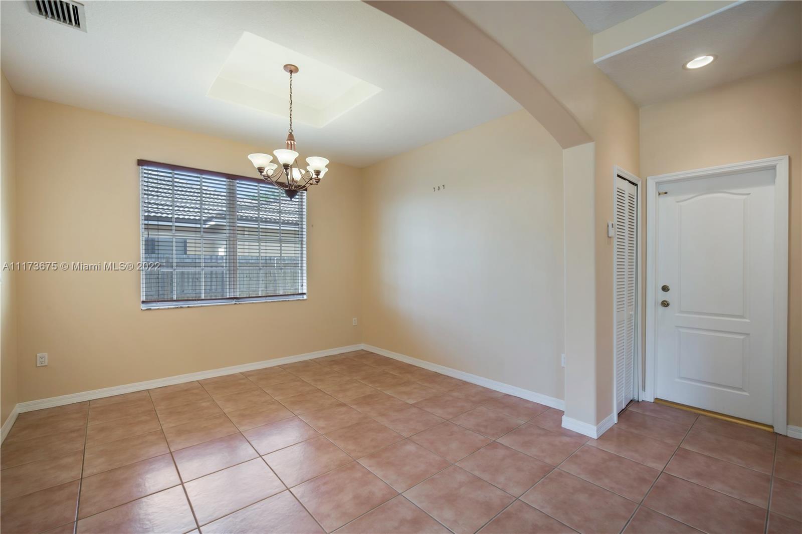 16234 Southwest 48th Terrace Miami, FL 33185 - Photo 10 of 45 a view of an empty room with a window