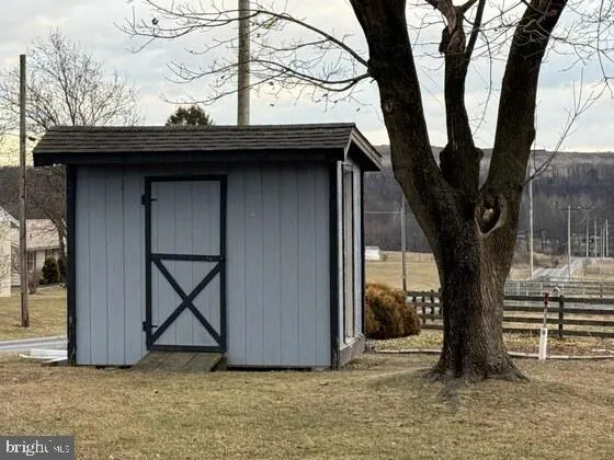 a house with trees in the background