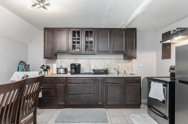 a kitchen with a sink and cabinets