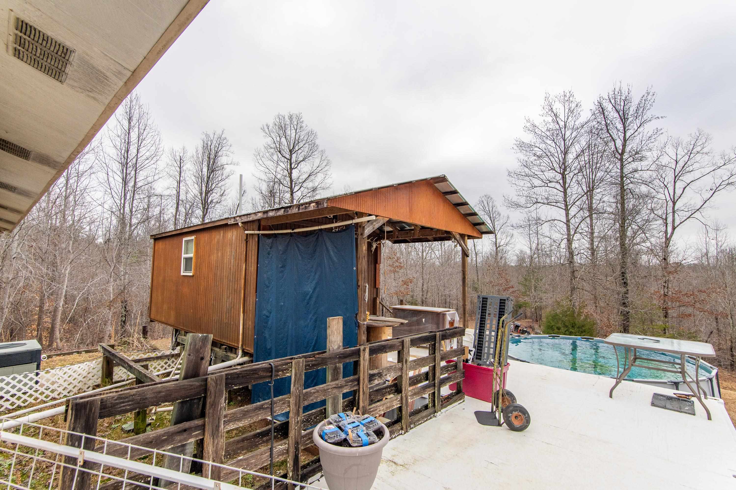 2040 Liberty Road Morris Chapel, TN 38361 - Photo 12 of 40 a backyard of a house with table and chairs