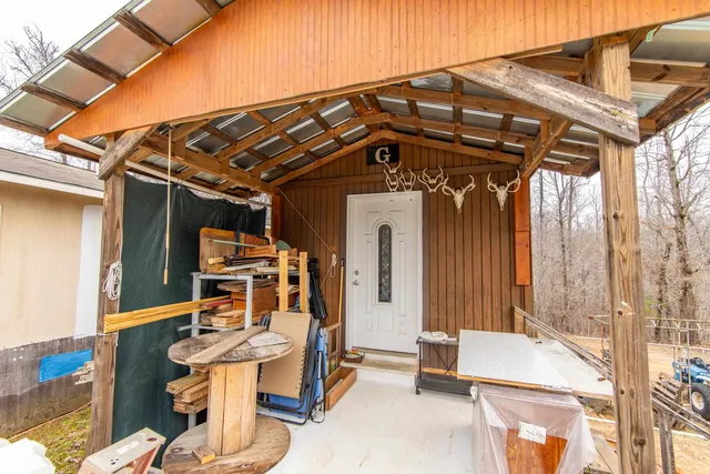 a view of a chairs and table in the patio