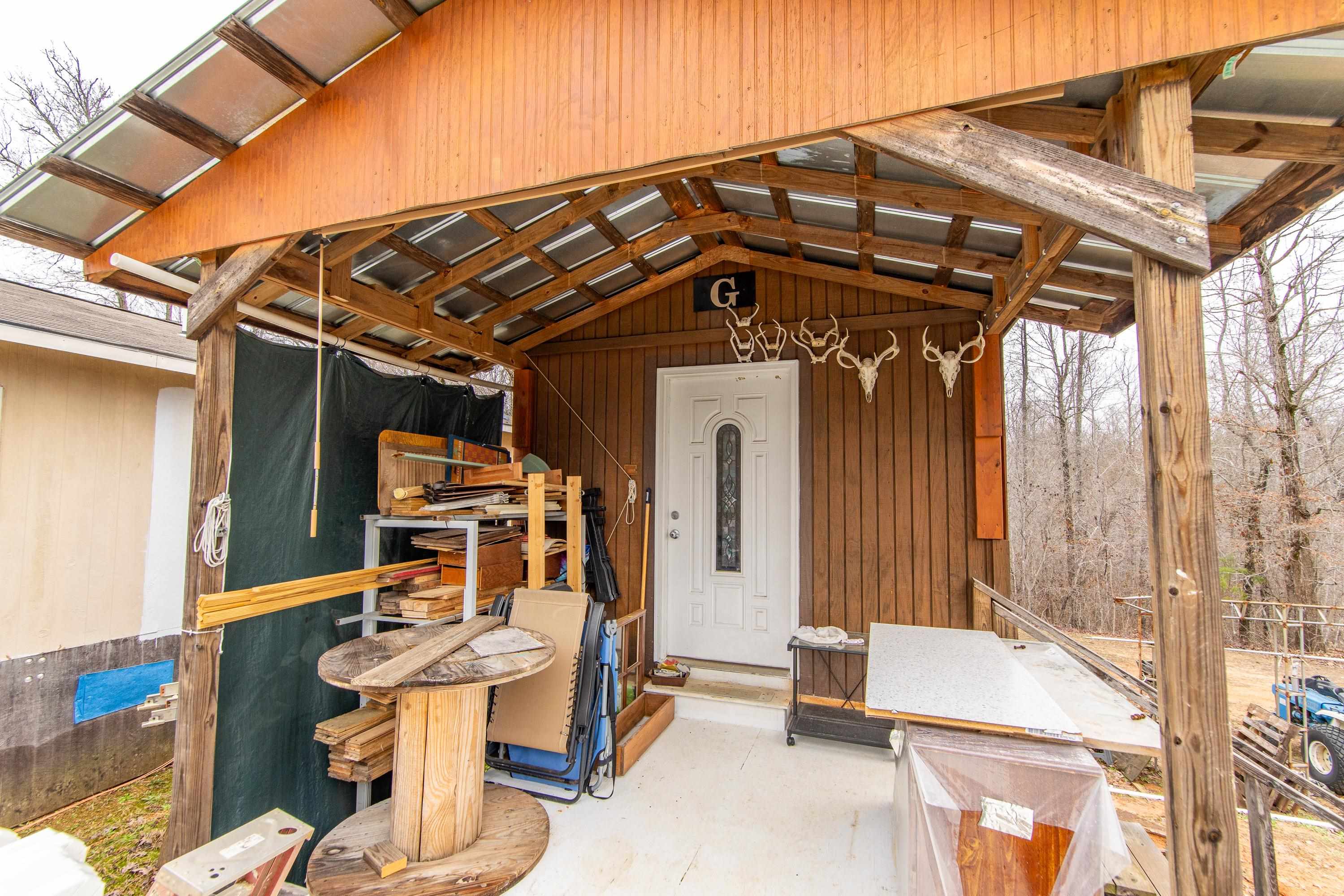 2040 Liberty Road Morris Chapel, TN 38361 - Photo 13 of 40 a view of a chairs and table in the patio