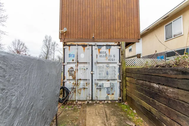 a view of a house with a yard and sitting area