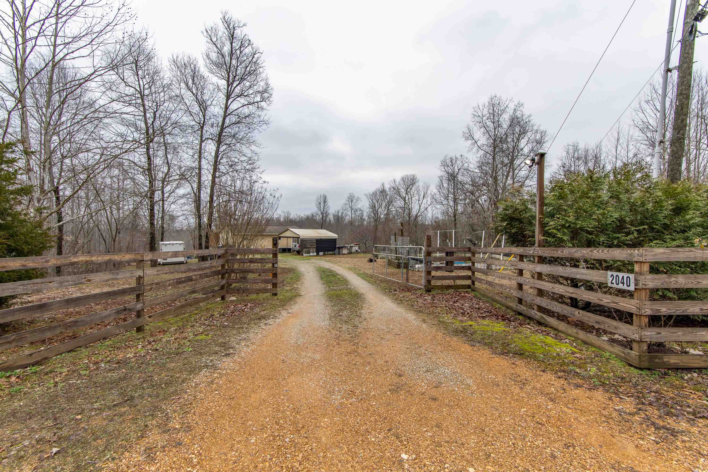2040 Liberty Road Morris Chapel, TN 38361 - Photo 26 of 40 a view of a yard with wooden fence