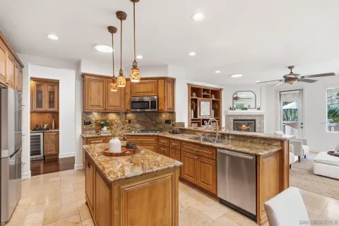 a kitchen with a stove sink and a refrigerator