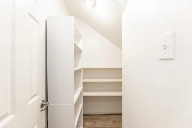 a view of staircase with white walls