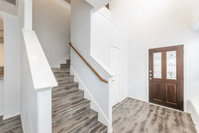 a view of entryway with wooden floor