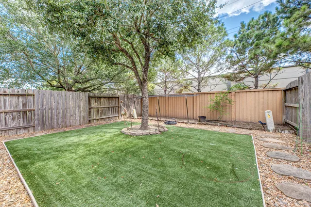 a swimming pool with wooden fence