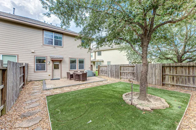 a house view with a sitting space and garden