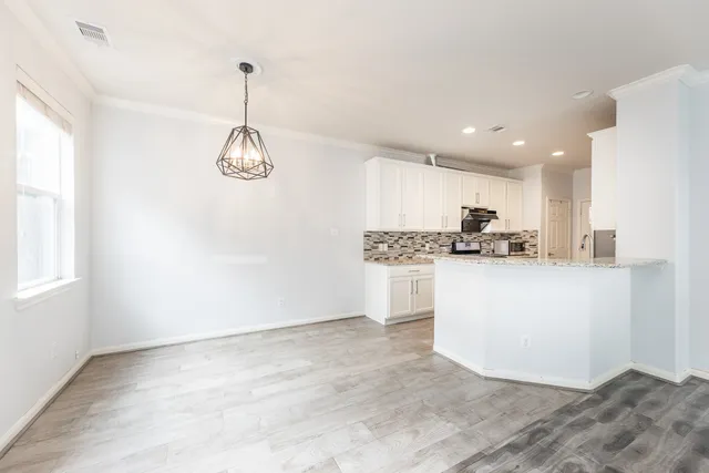 a view of kitchen view with wooden floor and window