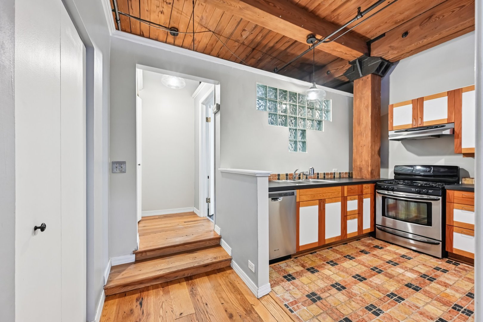 913 West Van Buren Street, Unit 5H Chicago, IL 60607 - Photo 18 of 23 a kitchen with stainless steel appliances granite countertop a refrigerator and a stove