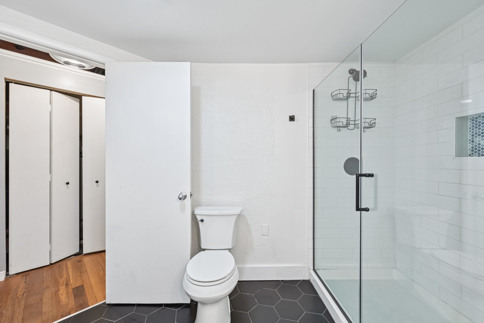 913 West Van Buren Street, Unit 5H Chicago, IL 60607 - Photo 22 of 23 a bathroom with a toilet and a shower