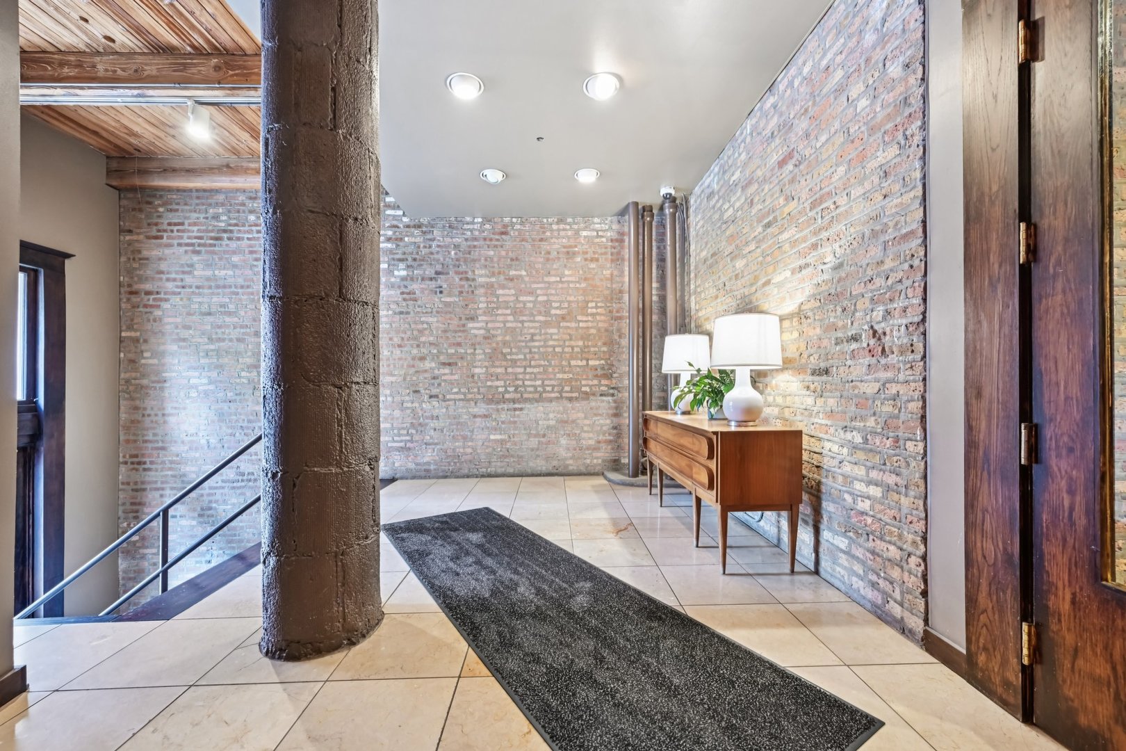 913 West Van Buren Street, Unit 5H Chicago, IL 60607 - Photo 5 of 23 a living room with furniture and a potted plant