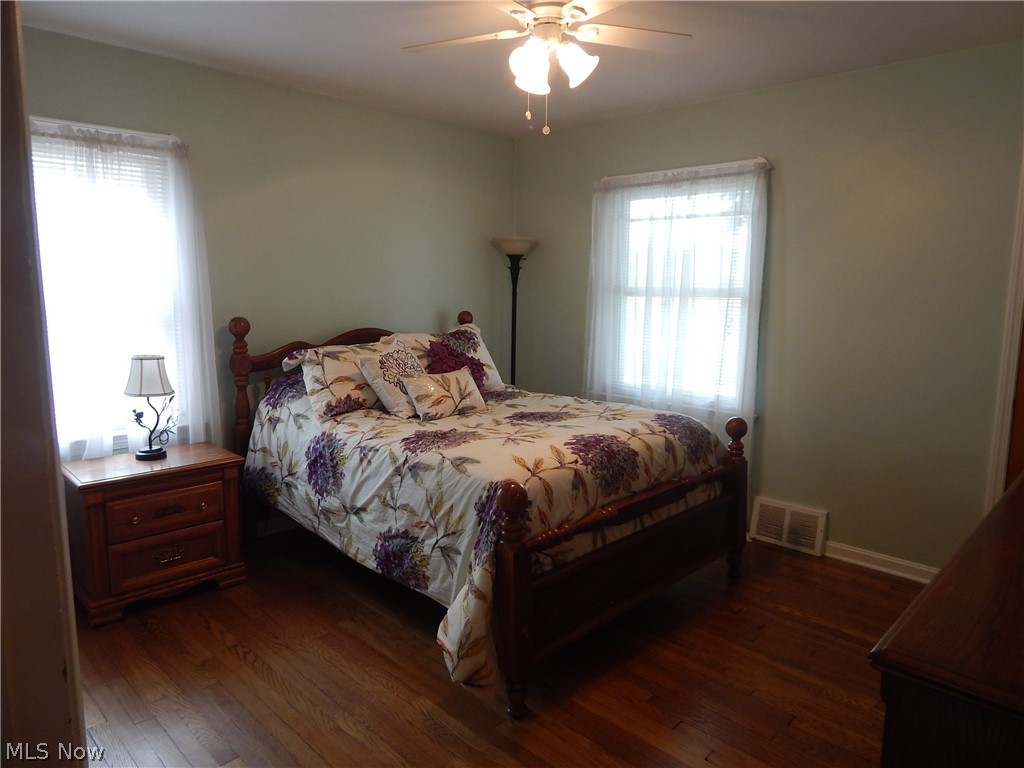 5701 Ackley Road Parma, OH 44129 - Photo 6 of 31 Spacious 1st Floor Master Bedroom Boast 2 Closets, refinished hardwood floors , new Ceiling Fan and Paint.