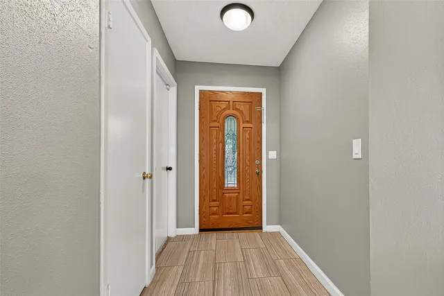 a view of a livingroom with wooden floor and closet