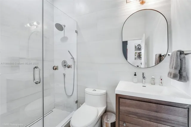 a bedroom with bed and a chandelier