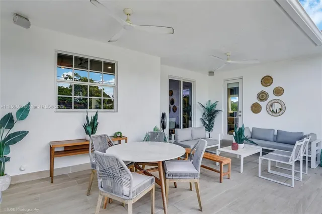a view of house with swimming pool outdoor seating