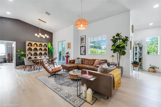 a living room with fireplace furniture and a flat screen tv
