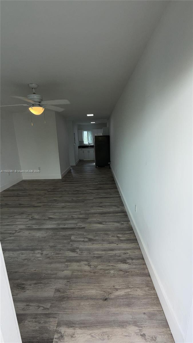 935 Jefferson Avenue, Unit 11 Miami Beach, FL 33139 - Photo 2 of 7 a view of a hallway with wooden floor