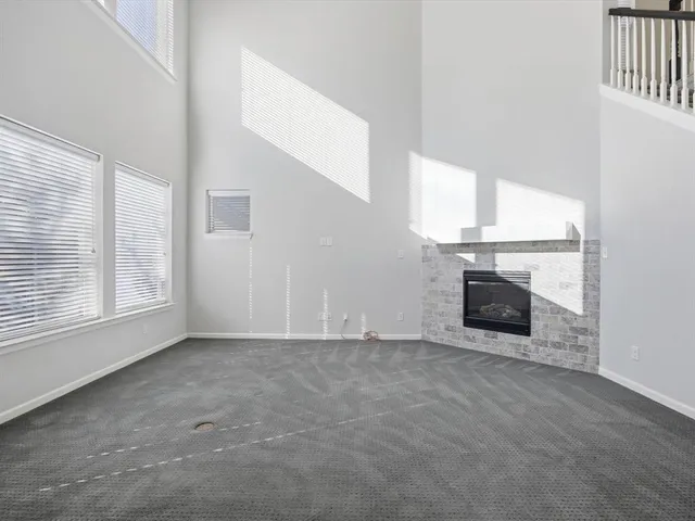 a living room with furniture fireplace and a flat screen tv