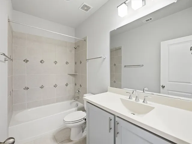 a view of workspace with cabinets