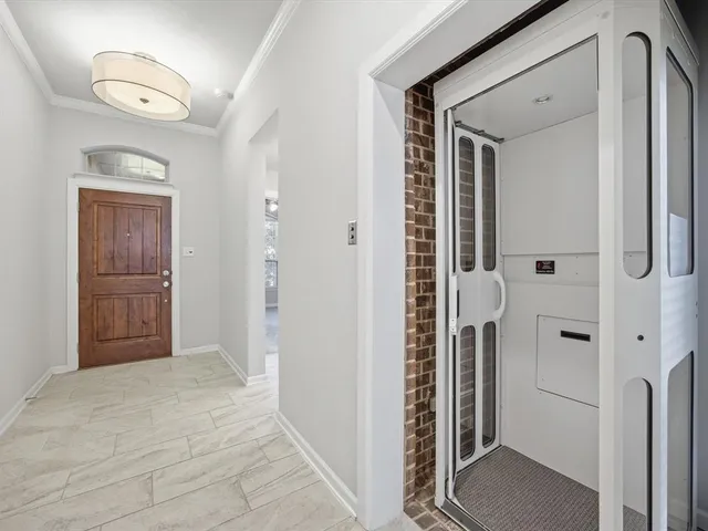 a bathroom with a shower and closet