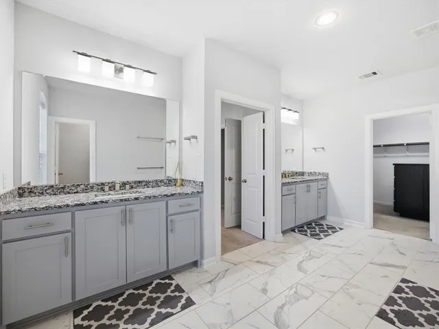a view of an empty room with a ceiling fan