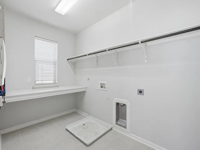 a bathroom with a bathtub shower sink mirror vanity and toilet