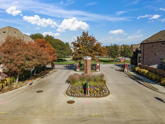 a view of a park with large trees