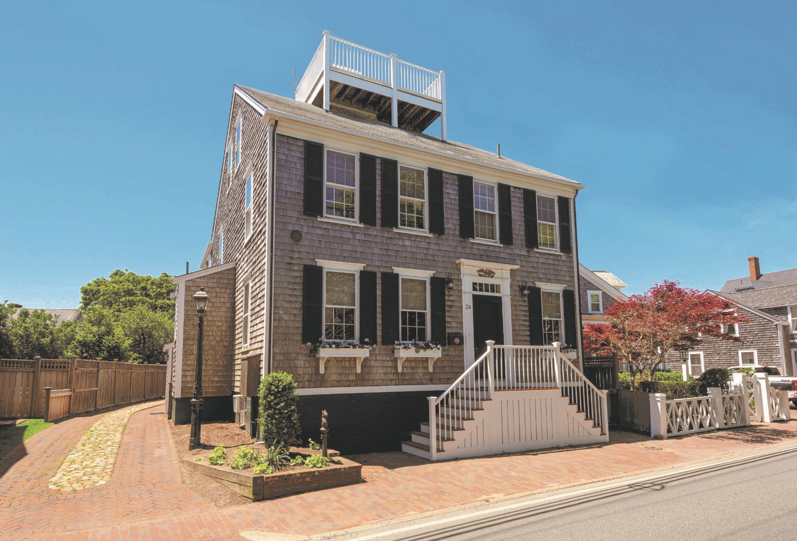 24 Cliff Road Nantucket, MA 02554 - Photo 1 of 44 a view of a building with a street