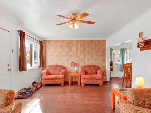 a view of a dining room with furniture and wooden floor