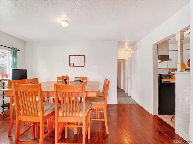 a kitchen with a sink a stove and cabinets