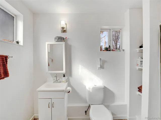 a view of a hallway with white walls