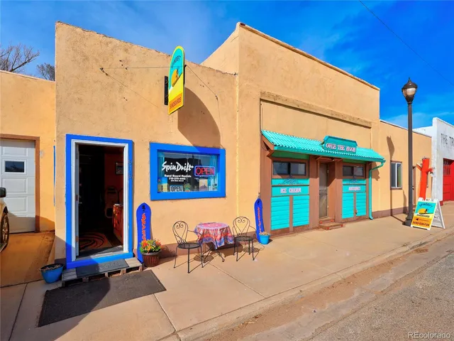 a view of a building with sitting area