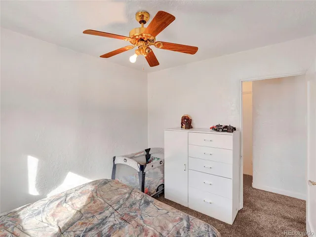 a white toilet sitting next to a shower curtain