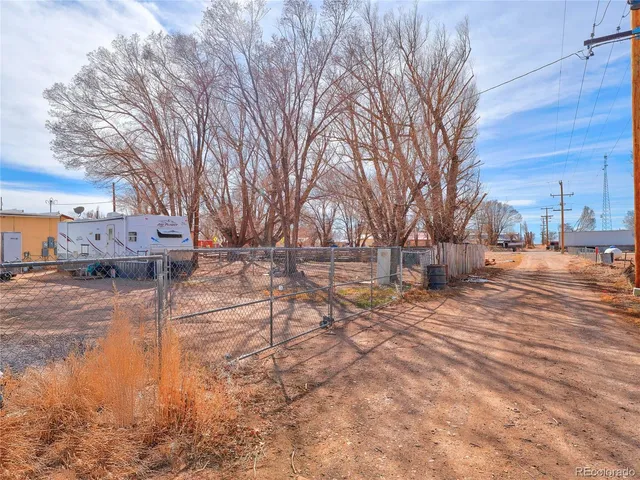 a view of a backyard with table and chairs