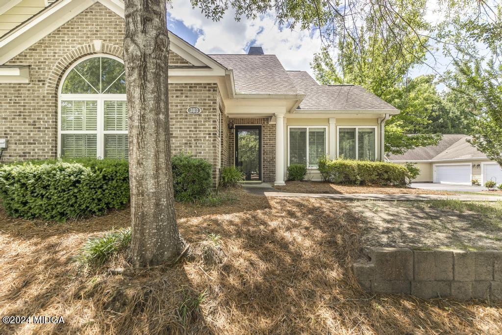 303 Cottage Lane Macon, GA 31210 - Photo 1 of 29 a front view of a house with garden
