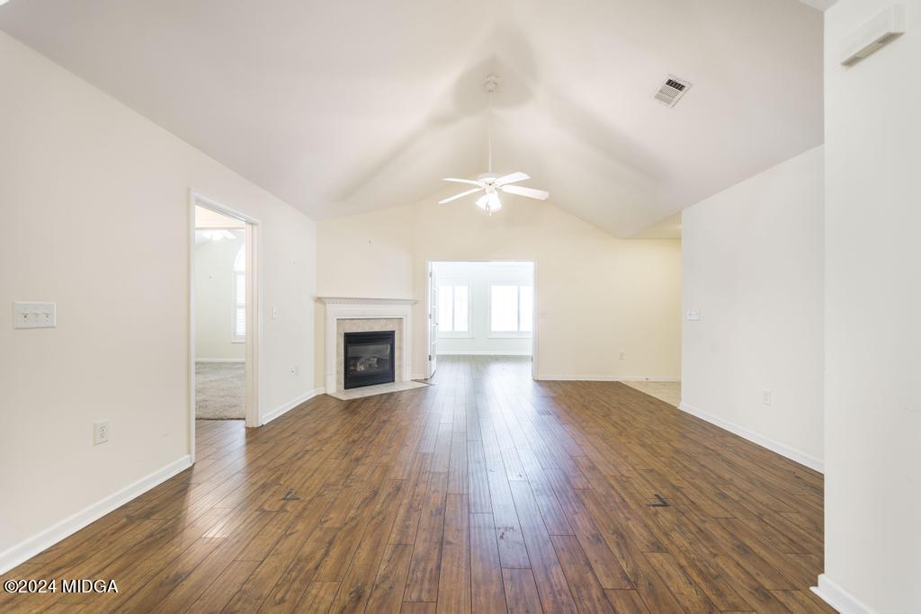 303 Cottage Lane Macon, GA 31210 - Photo 11 of 29 a view of an empty room with wooden floor and a window