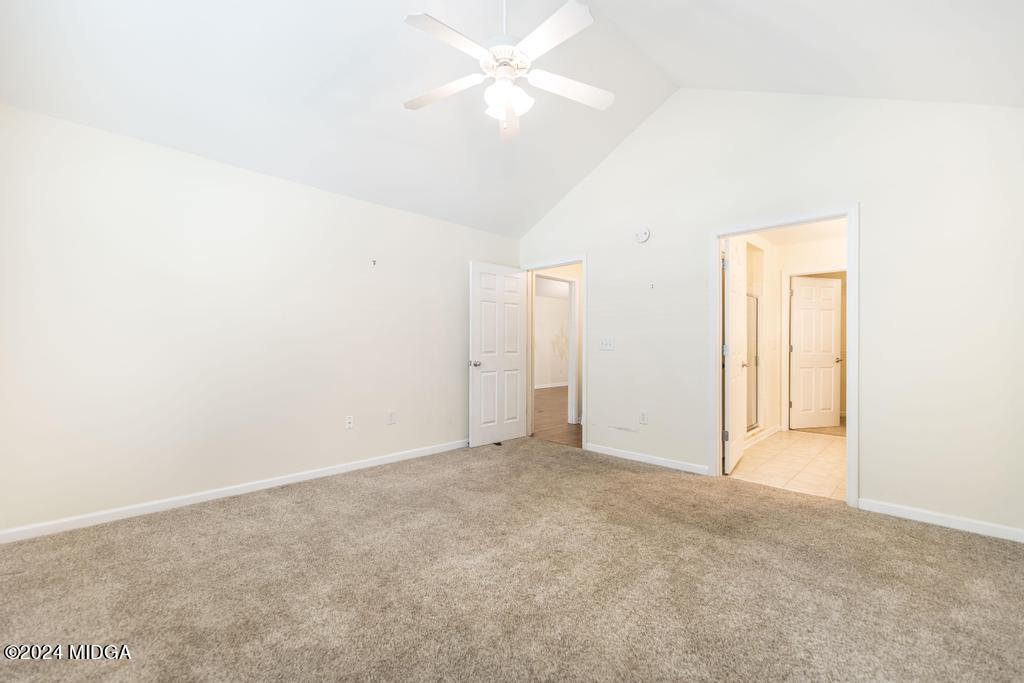 303 Cottage Lane Macon, GA 31210 - Photo 24 of 29 an empty room with closet and a ceiling fan